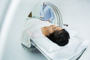 Women laying in CT Scan Machine