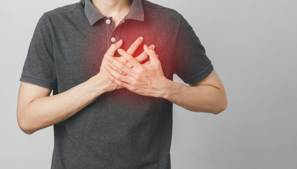 Man has chest pain suffering by heart disease, Cardiovascular disease, heart attack. Health care concept