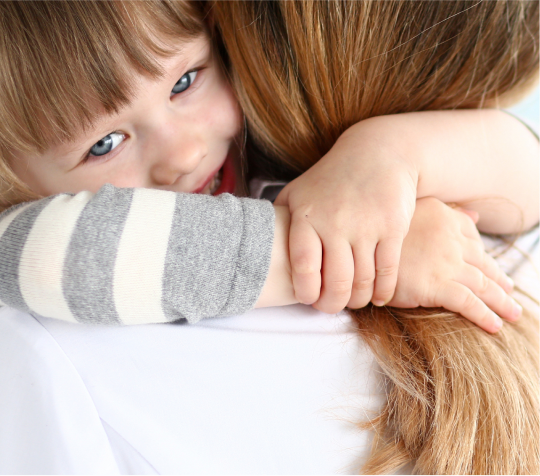 Child hugging woman
