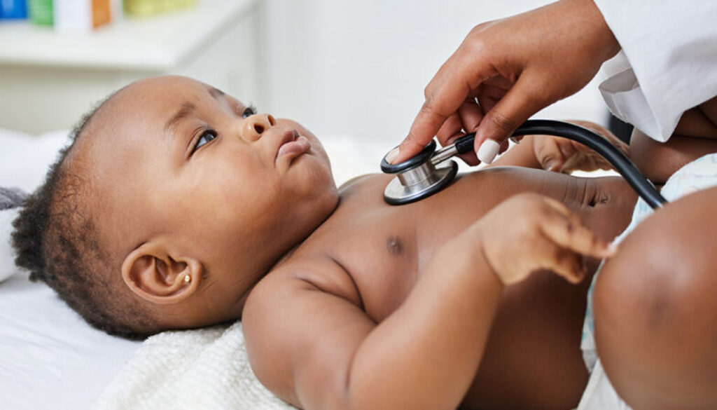 A baby getting their heartbeat checked