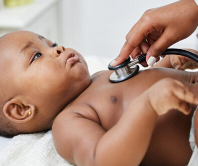 A baby getting their heartbeat checked